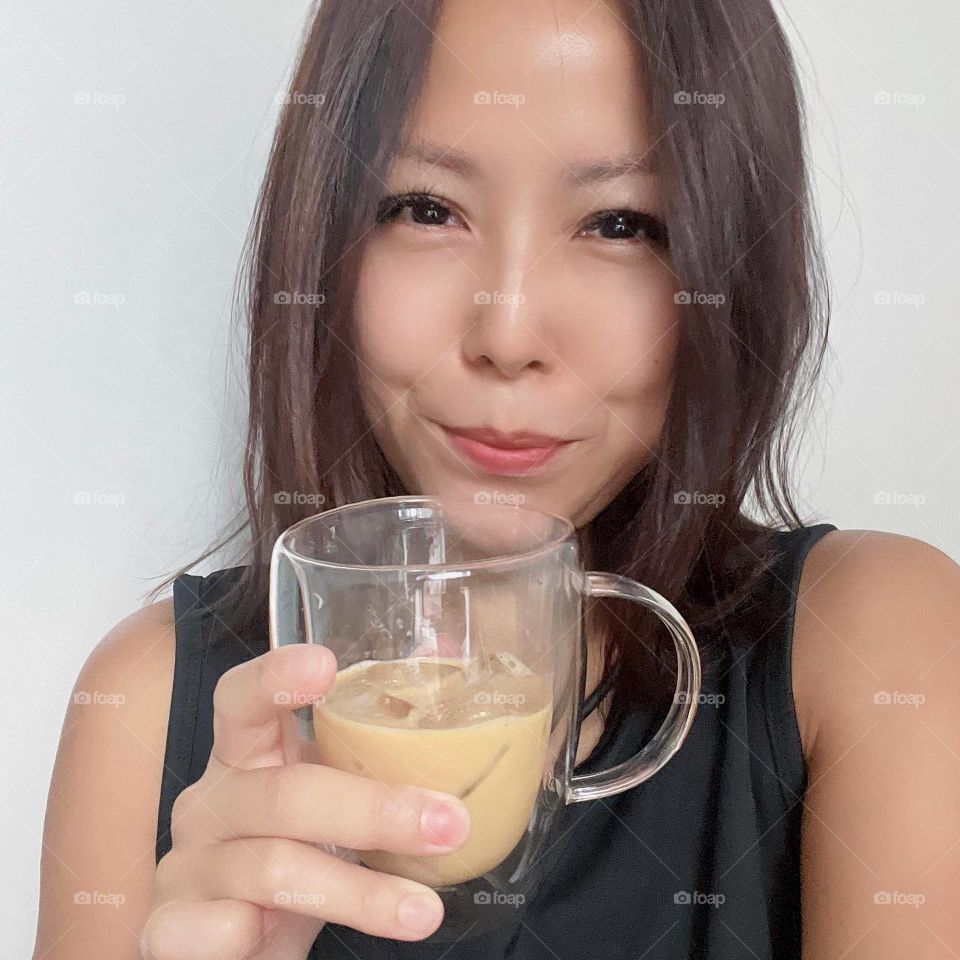 Asian lady with Cold brew coffee drink 