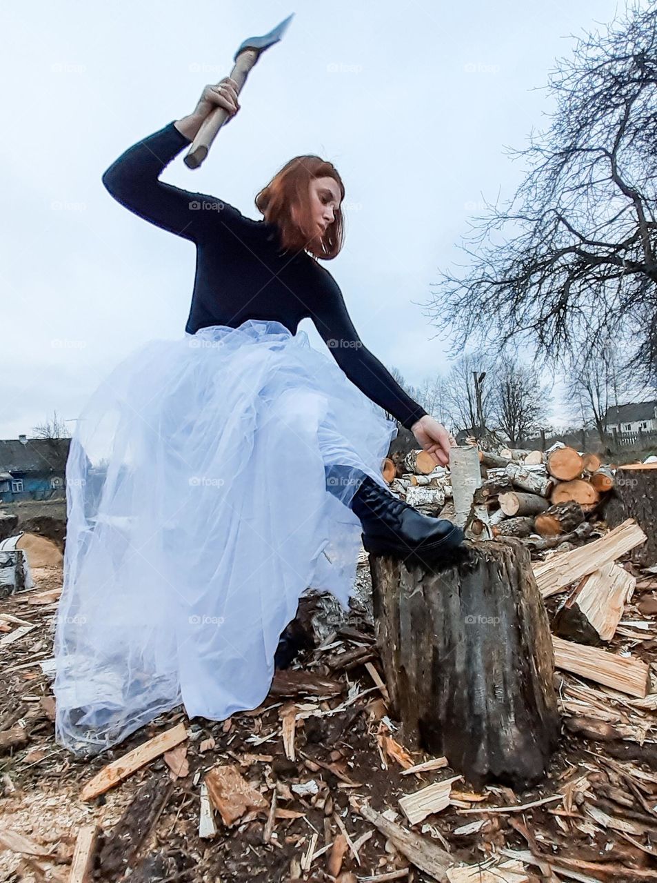 an unusual photo of a young, fragile girl who performs men's rough work