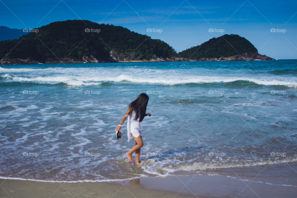 Pés na Areia do Mar