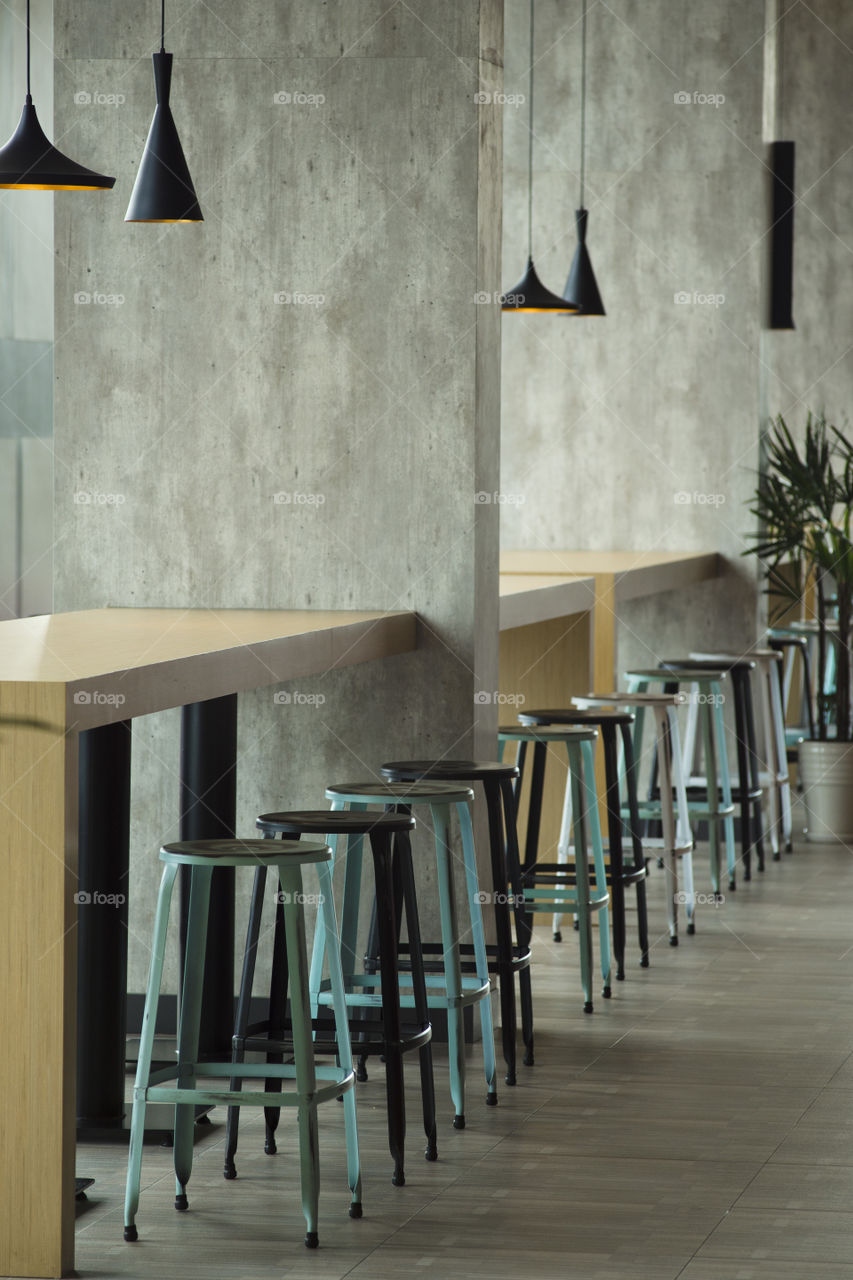 high stool bar chairs at empty restaurant