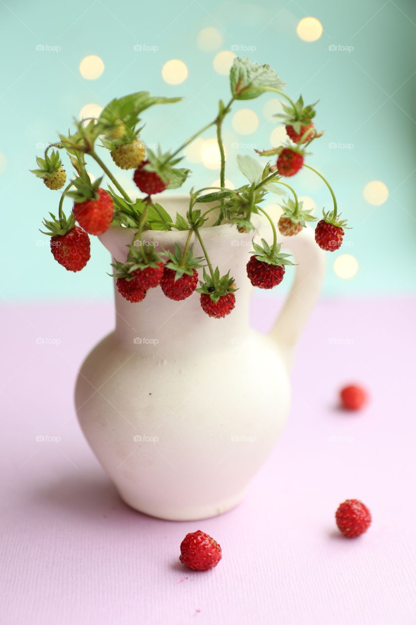 strawberries in a jug