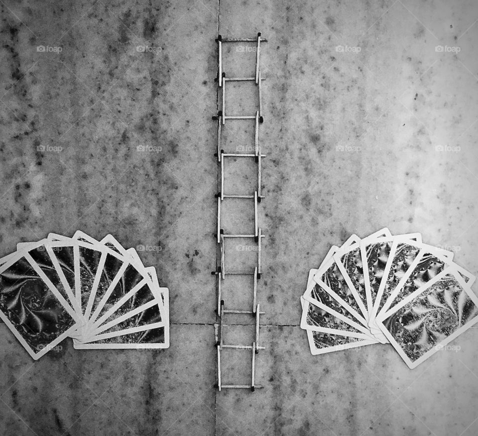 Playing cards and ladder