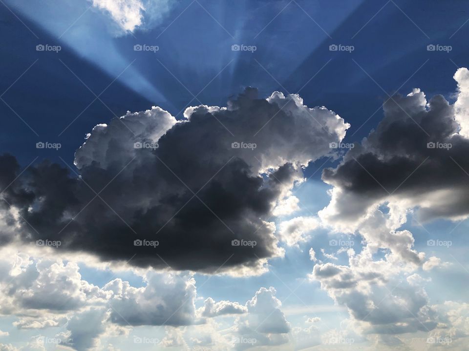 Sun behind the clouds in a warm Autumn afternoon... the effect of the sun’s rays is a show in itself..