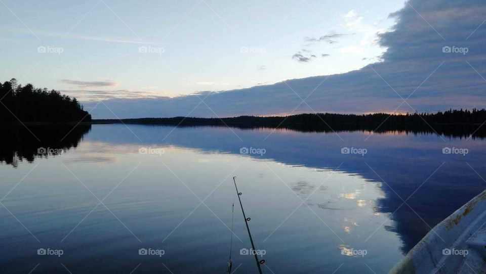Fishing on a beautiful evening, in Lapland, Finland