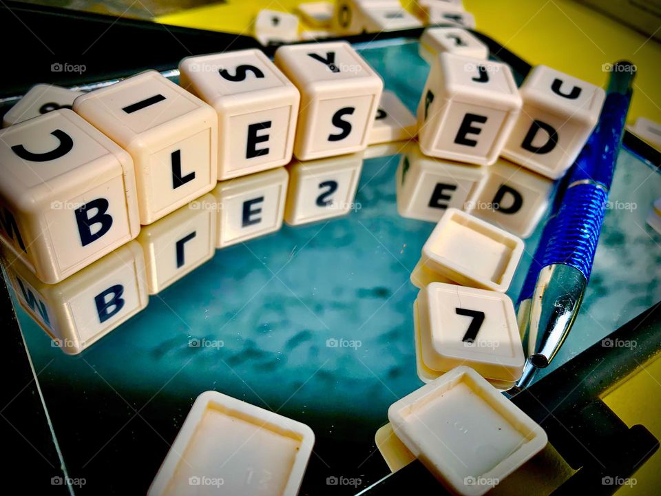 Blocks Reflecting “BLESSED” Letters In The Mirror 