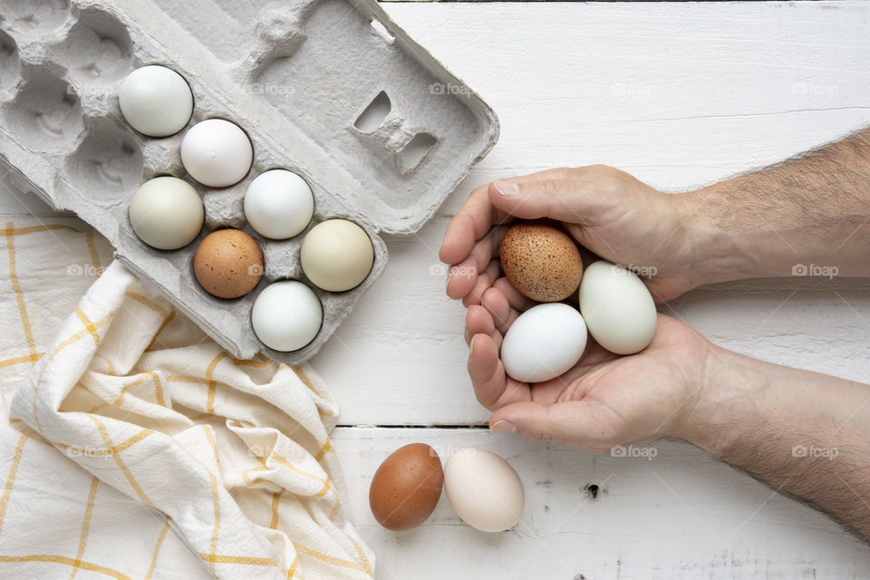 Hands holding eggs