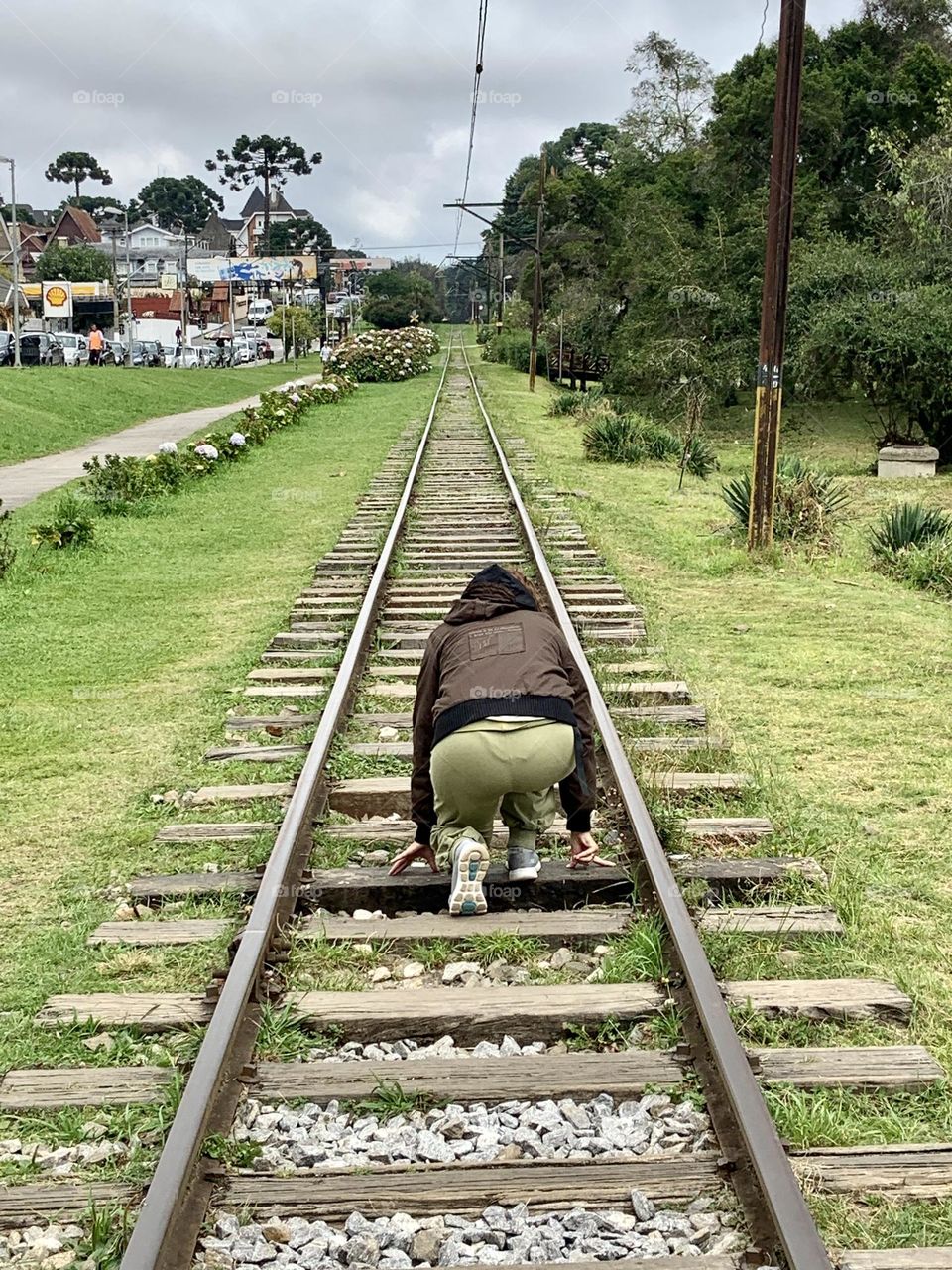 Woman on railroad preparing to run 