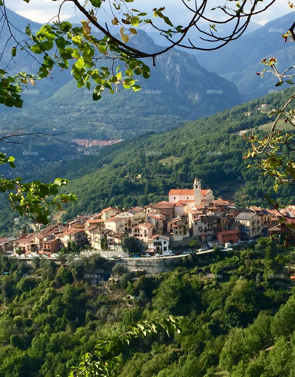 Old French Village

This photo was taken in the mountains of France along our drive to La Cote d'Azur.  It's a very old French village and looked quite charming from far away. I imagined what it may be like living in such a private little place in the middle of the mountains.