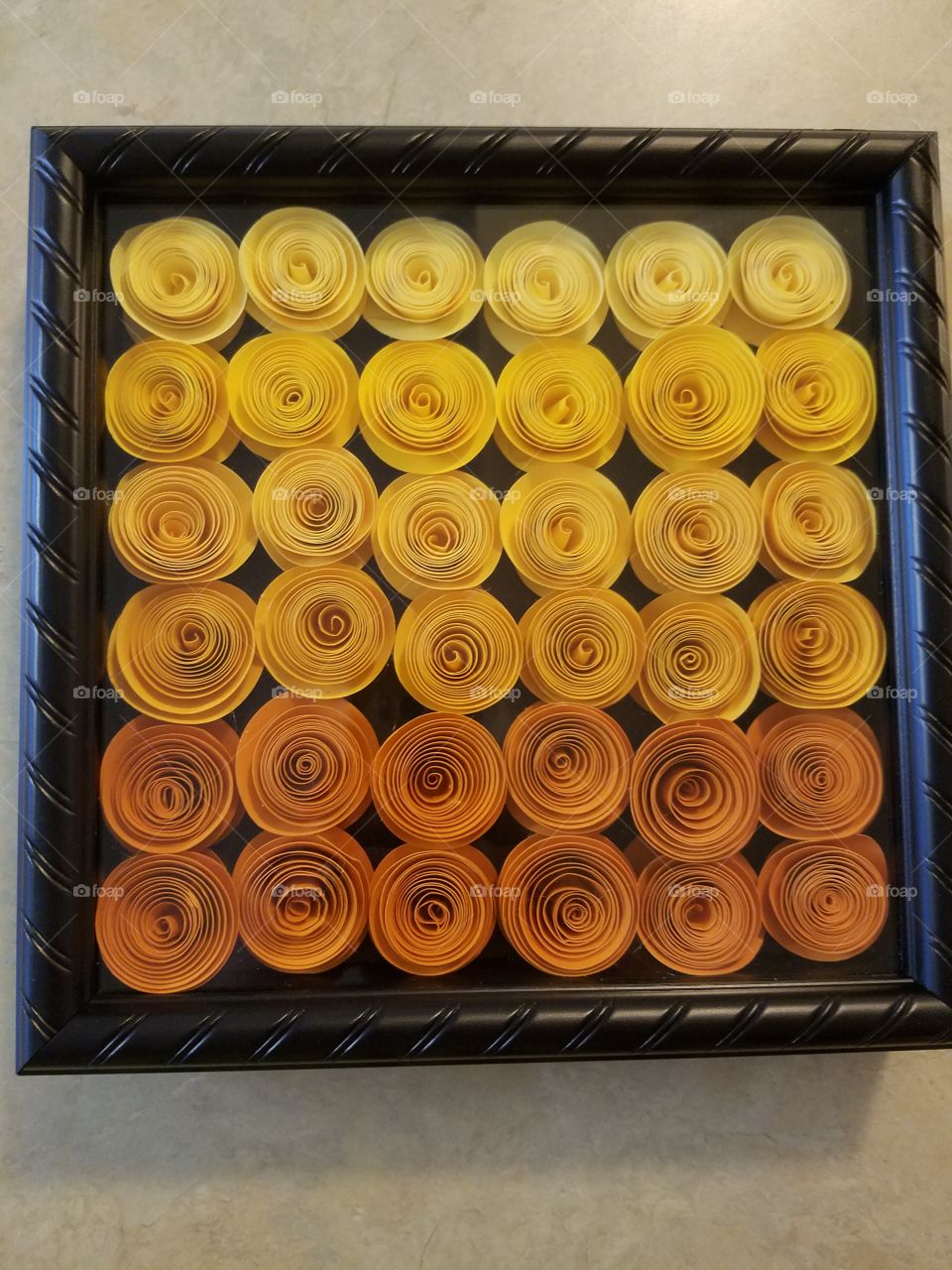I made this for a friend. Ombre orange and yellow paper roses inside a shadow box!