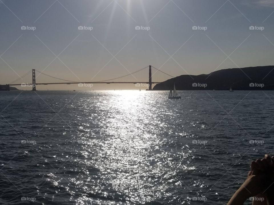 golden gate bridge with sail boat october