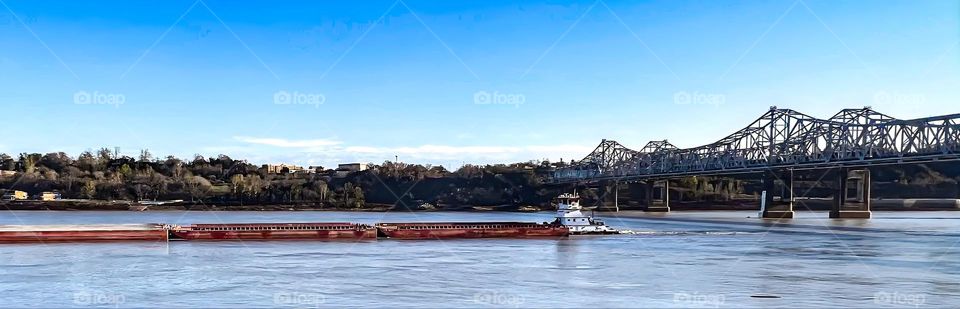 The traffic of barges down the Mississippi River after it had been slowed due to the drought.
