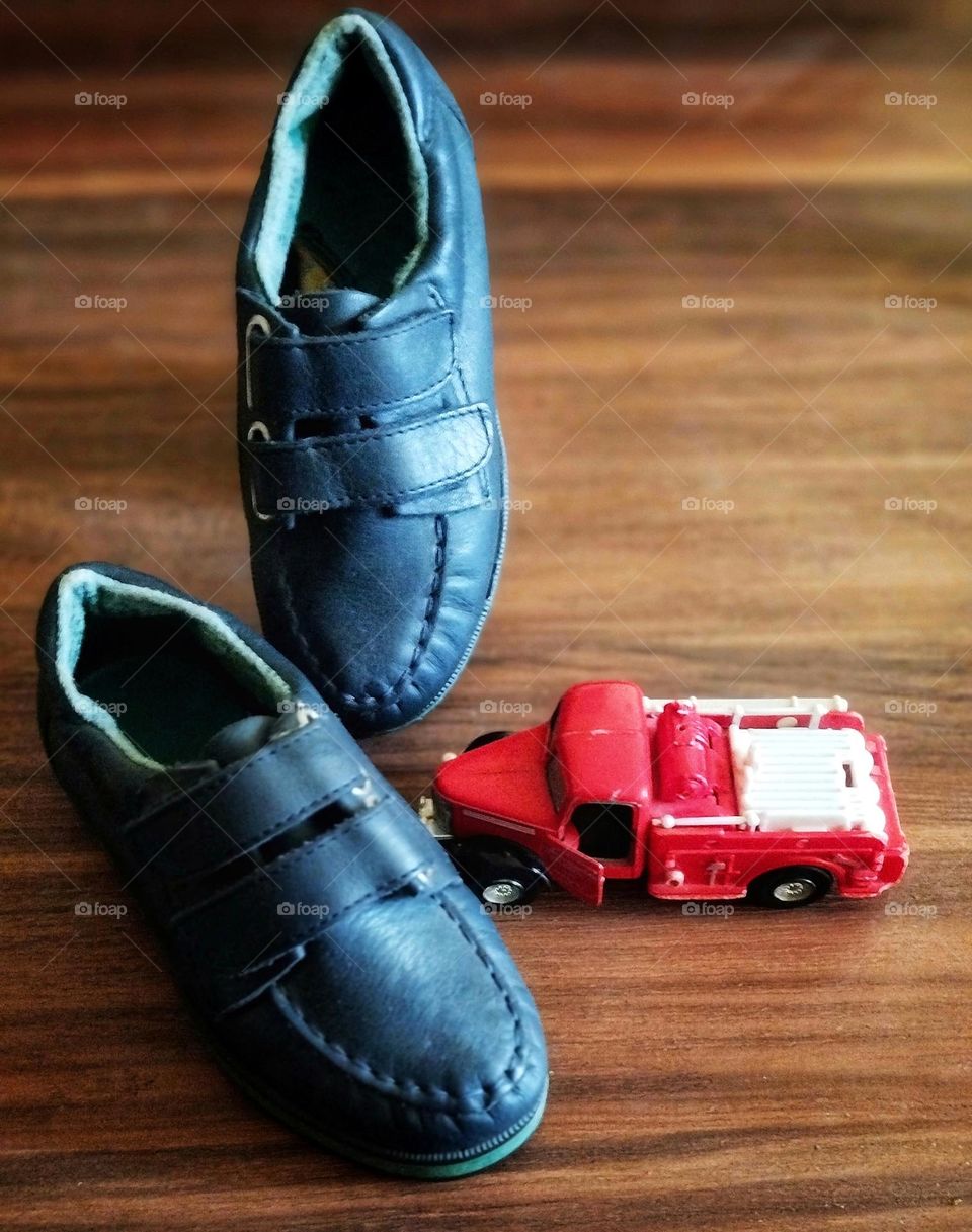Good old days.Everyone who was brought souvenirs from Europe was in a very good mood, like these souvenirs: my husband 's navy blue leather shoes and this red cute fire engine(only remaining toy from his childhood) were brought to our loving home