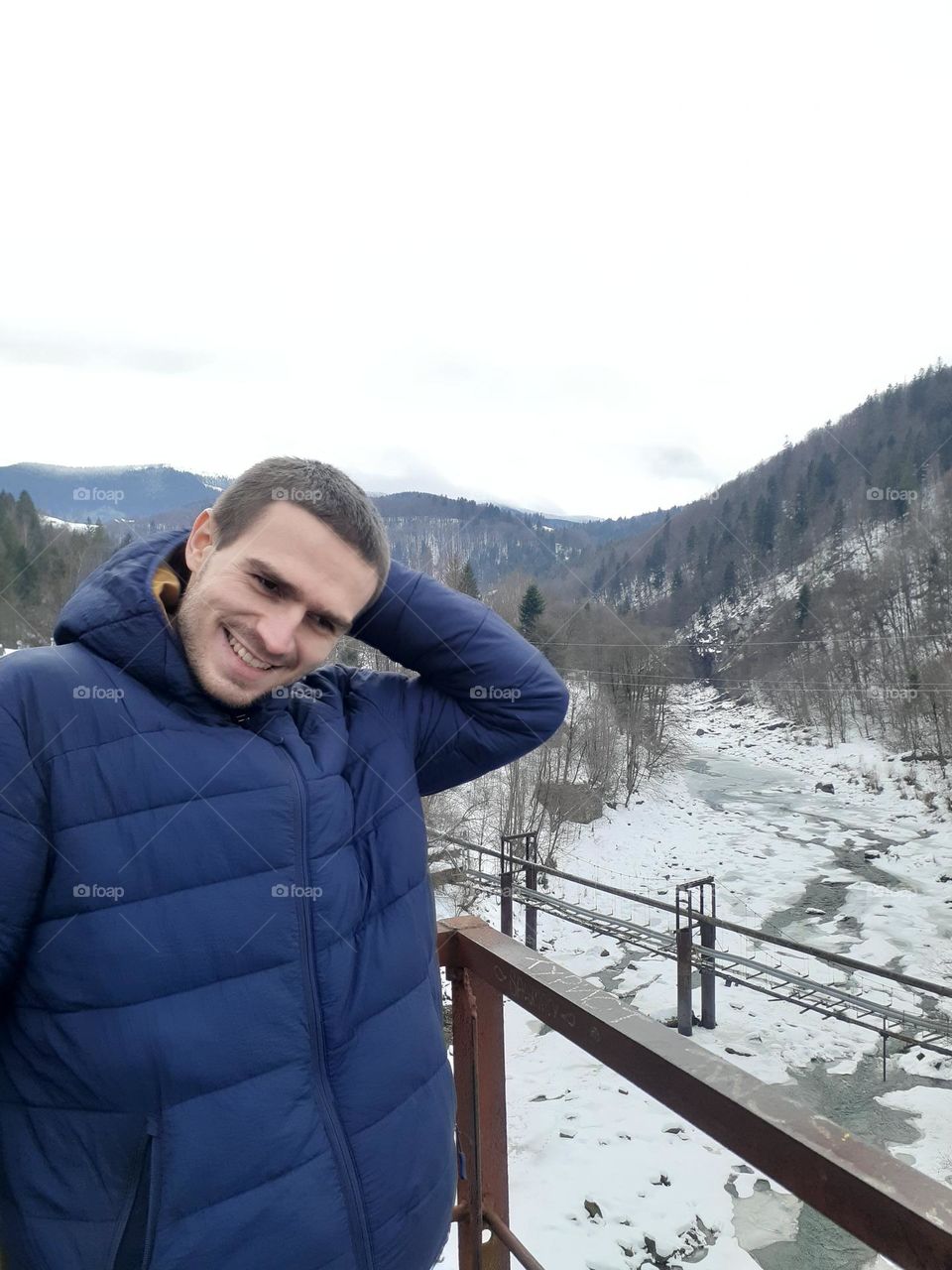 Portrait of a happy man in the mountains