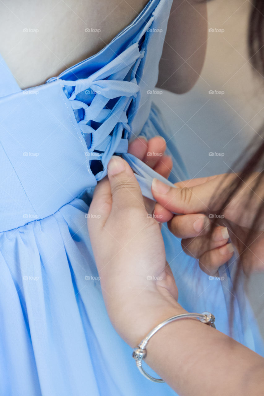 Woman adjusting dress