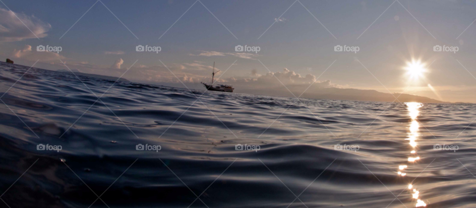 sunset sea diving indonesia by paulcowell