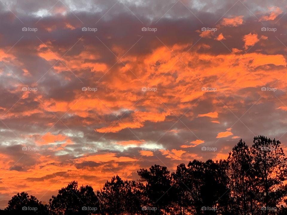 Orange reflection of sunset in the clouds