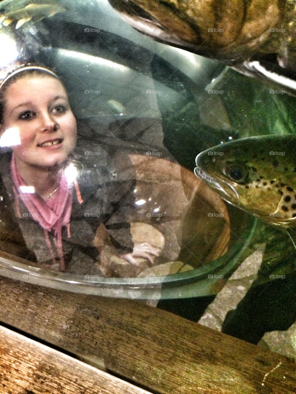 Girl looking in fish tank