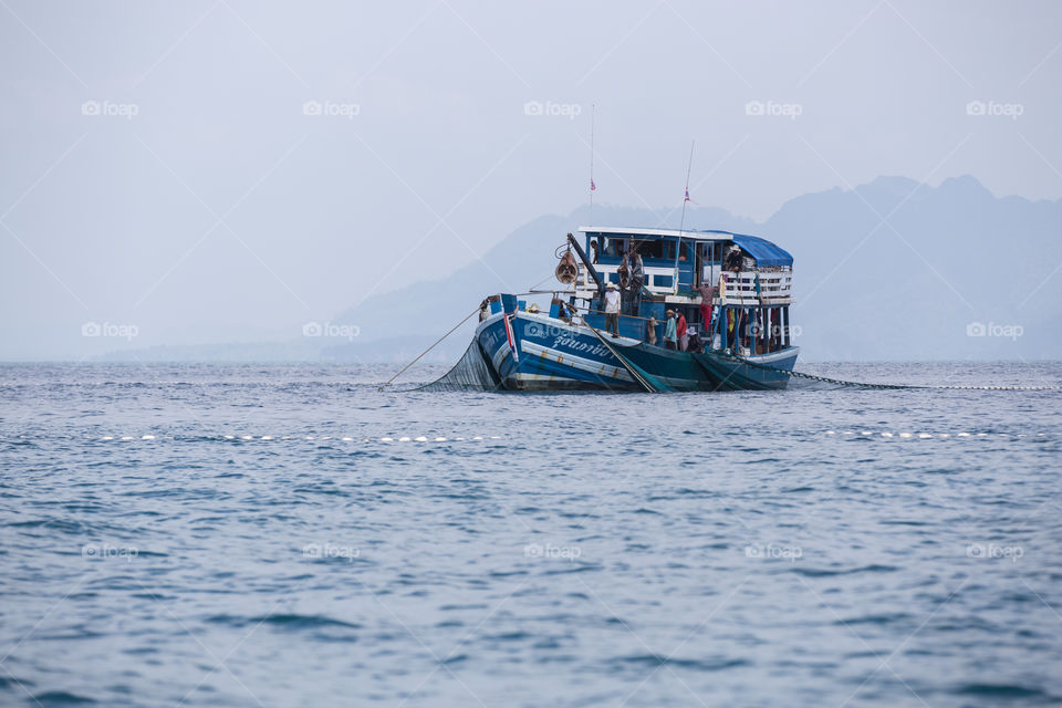 Fishermen boat fishing in the sea