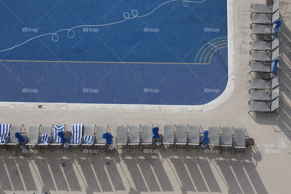 Chairs by poolside topview