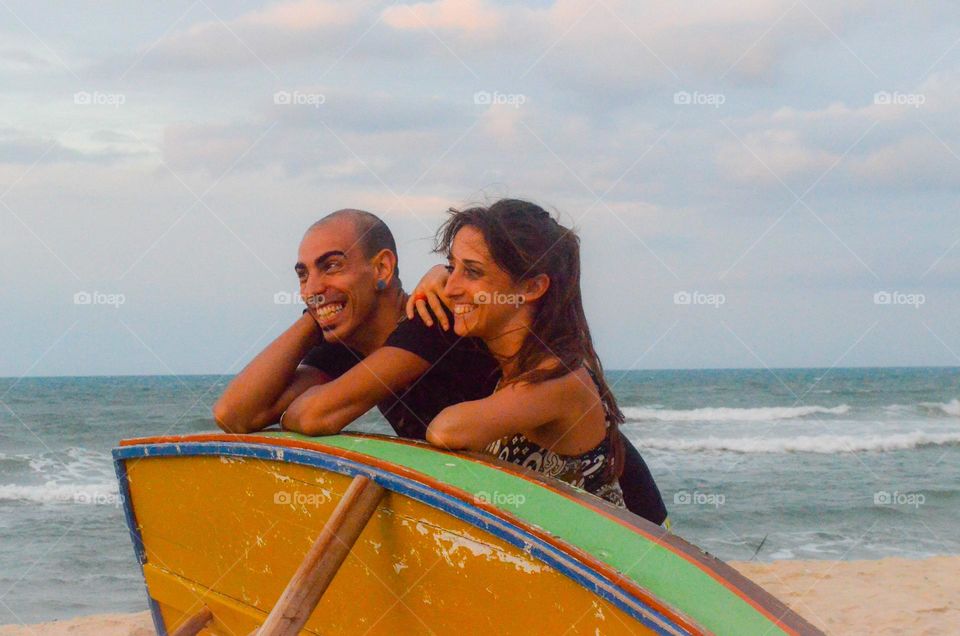 Couple on boats smiling 