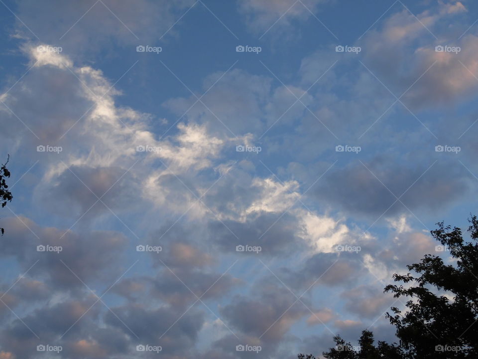 blue sky. This is a picture I took of some clouds God provided for me so I could upload them to you