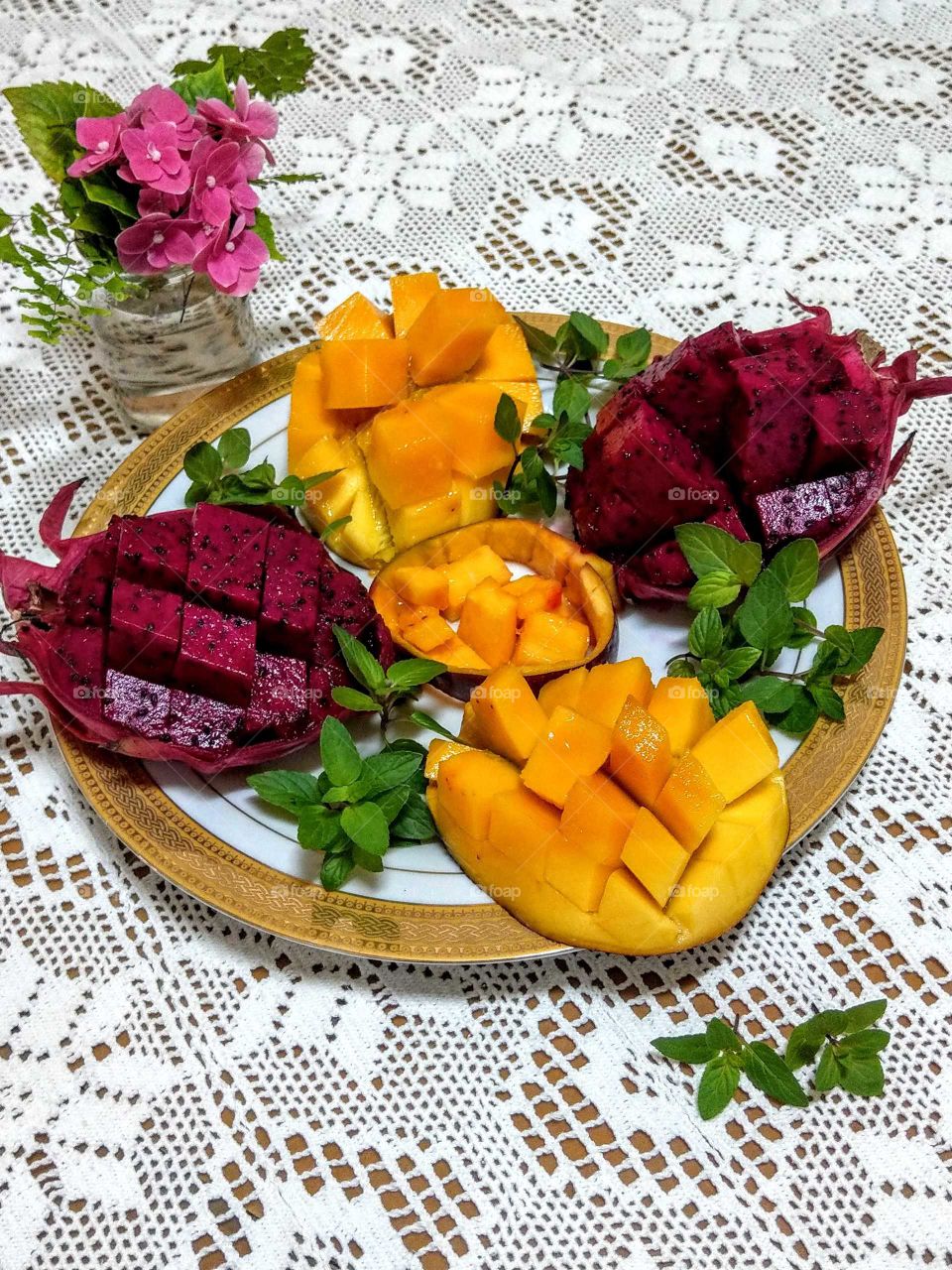 Fruits: Mango(Irwin) & Pitaya(Dragon fruit) red. cut open. easy eating way.  tasty, sweet, fruity odour, juicy and color beautiful.