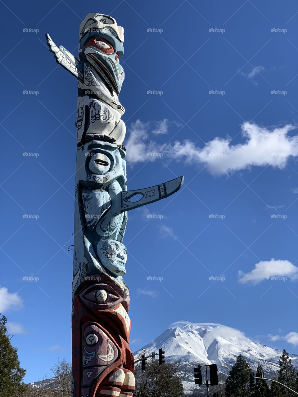Totem Pole stretched up high with blue skies in Mt Shasta