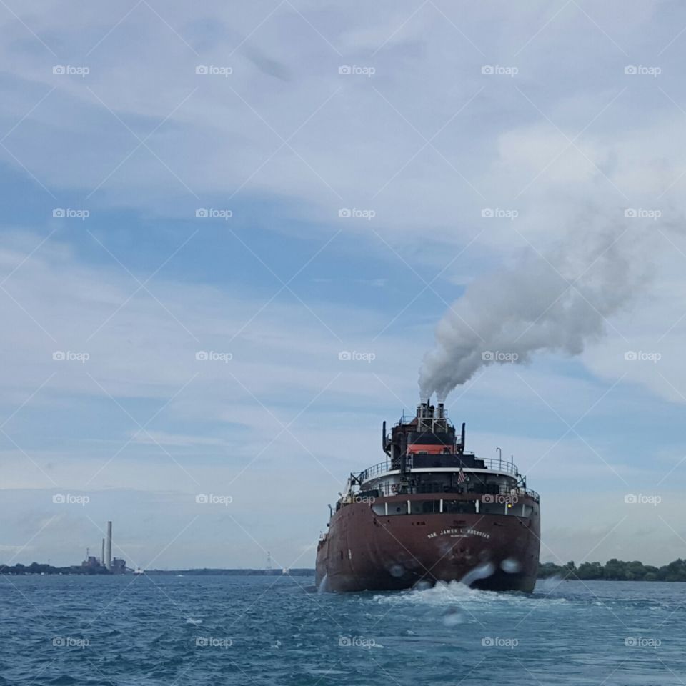 Great Lakes freighter cruising up the St. Clair River