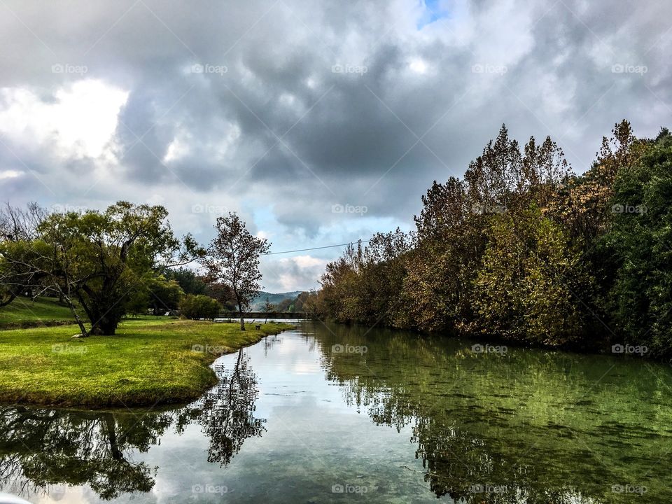 Storm clouds reflecting on lake