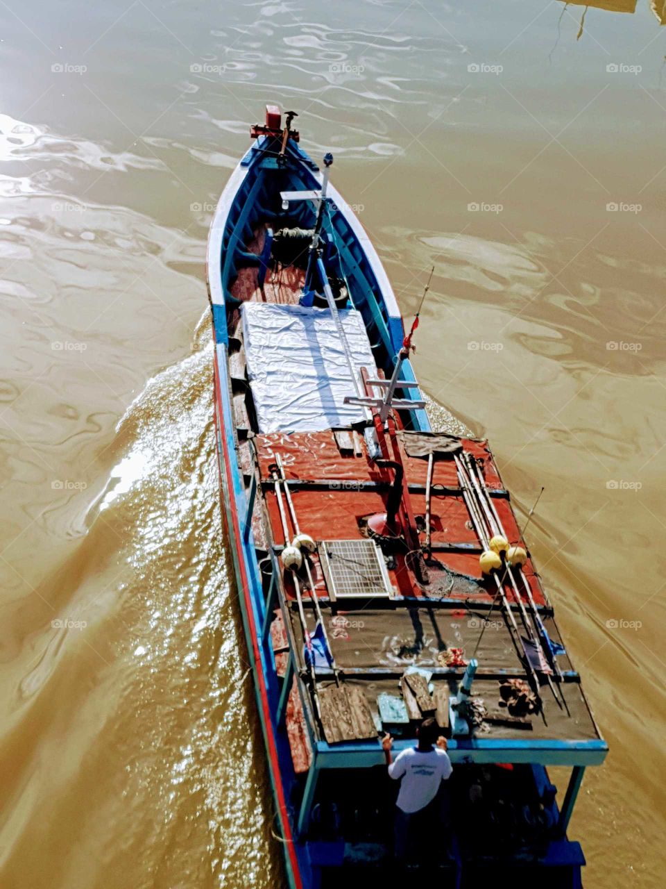 traditional boat move towards the estuary