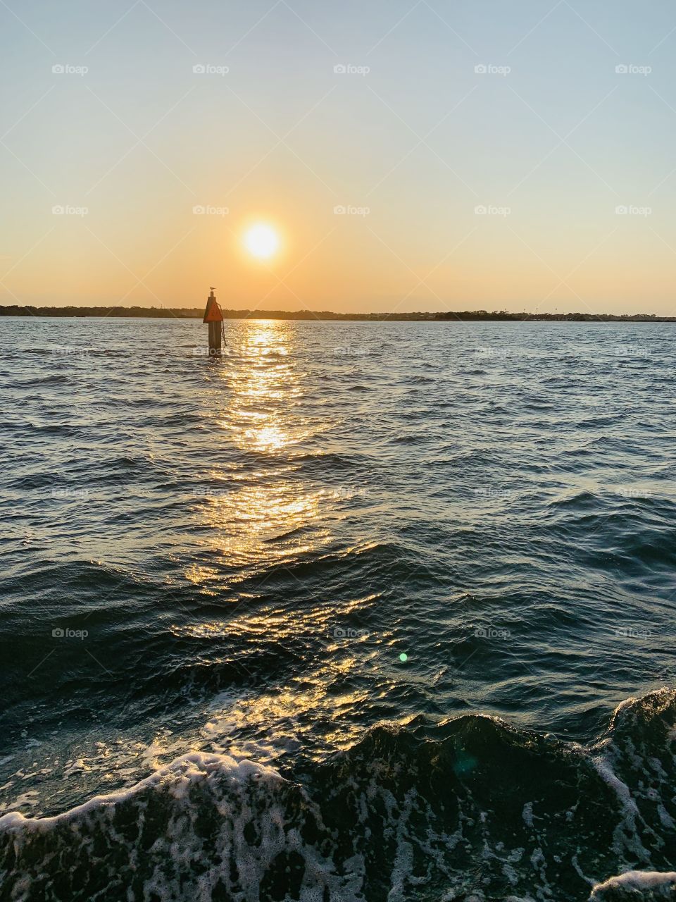 With the sun bouncing off the water and the light shimmering on the ocean 