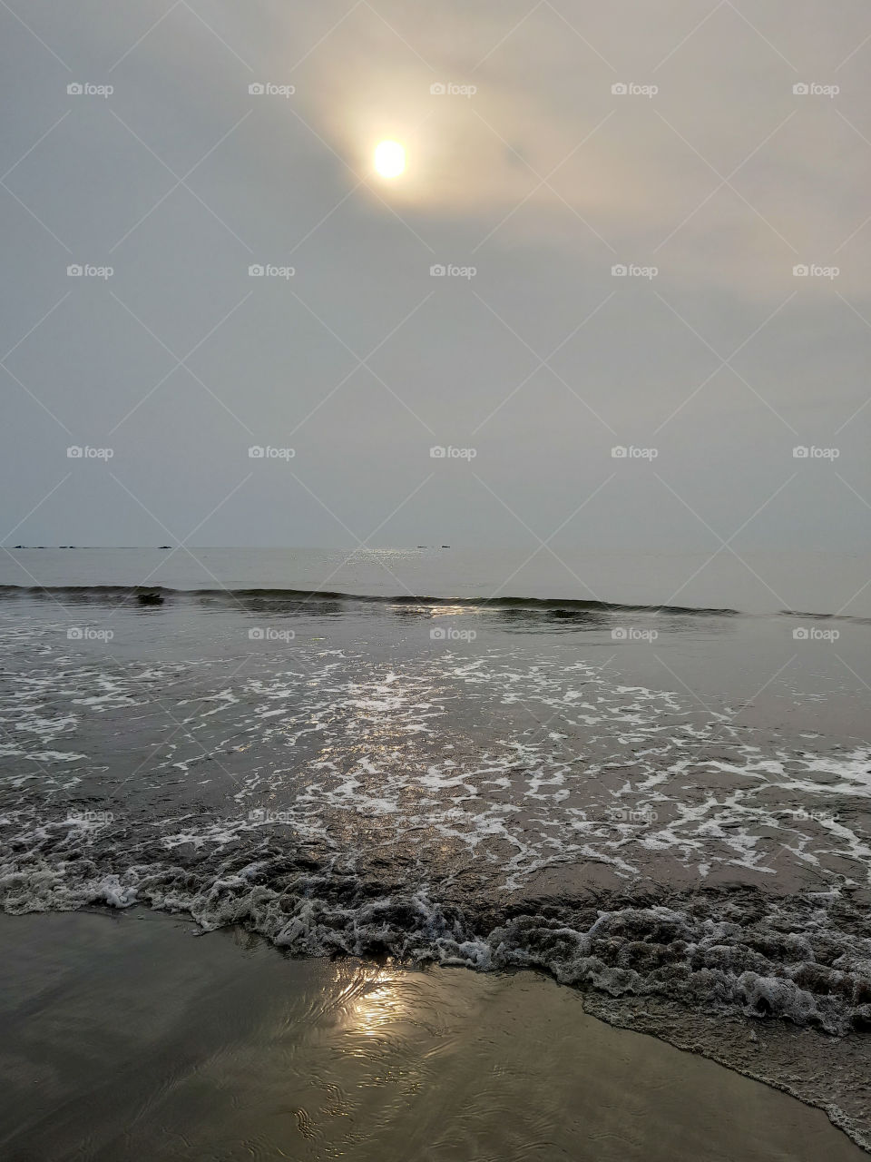 Sunset reflection on Anyer beach