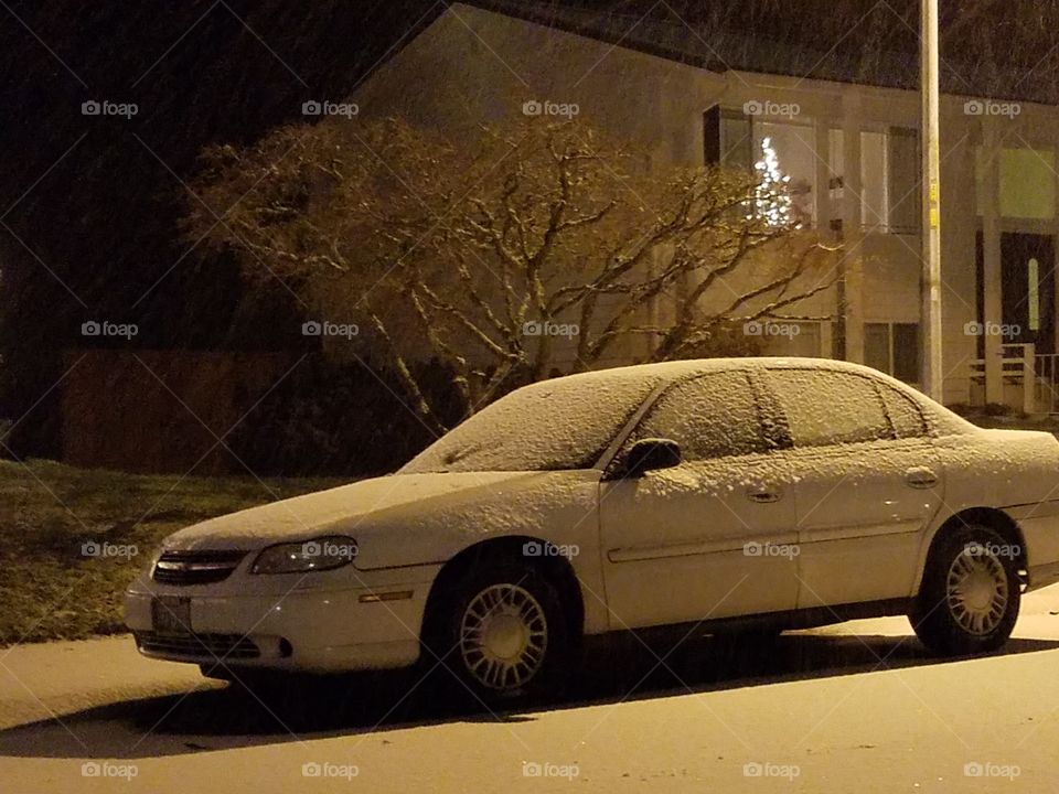 random snow covered car