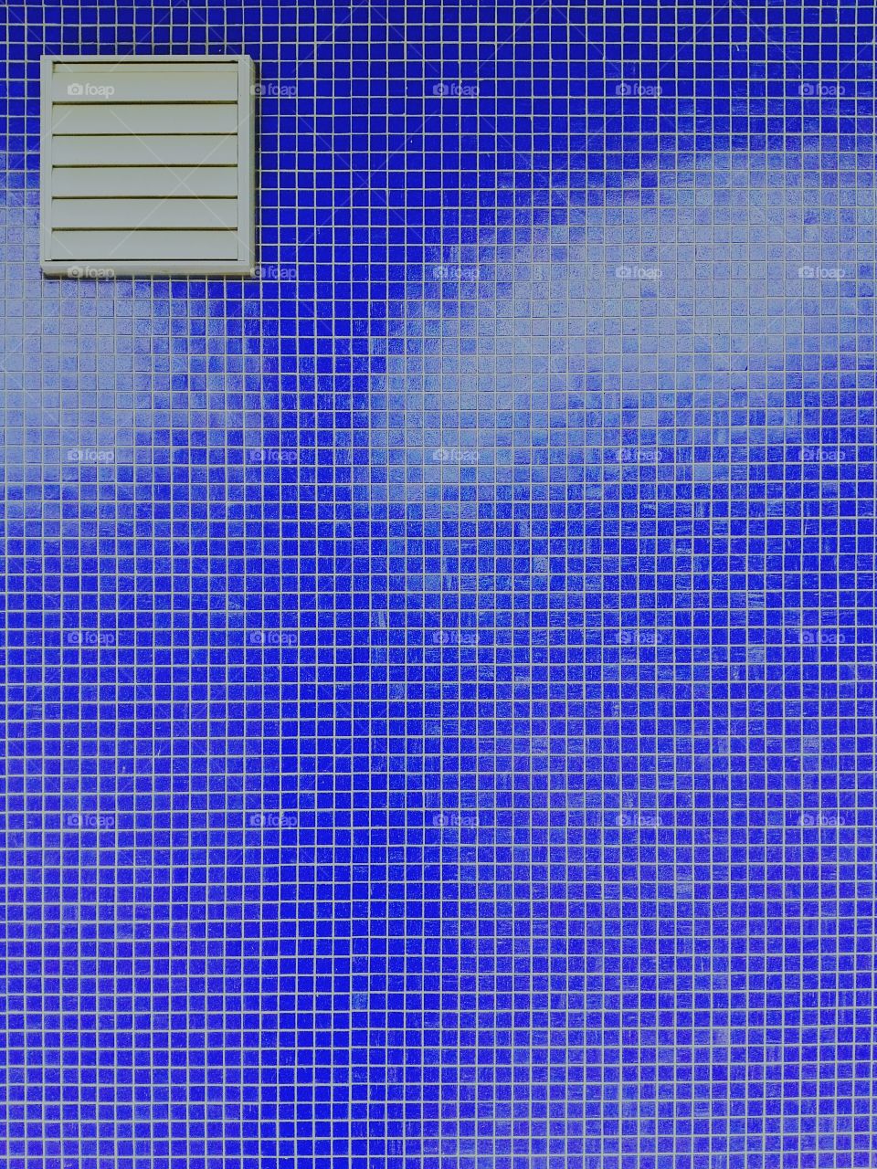 Air duct on blue tile