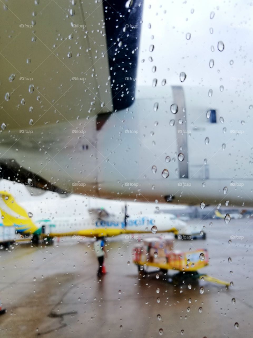 Outside the window of an airplane on a rainy day.