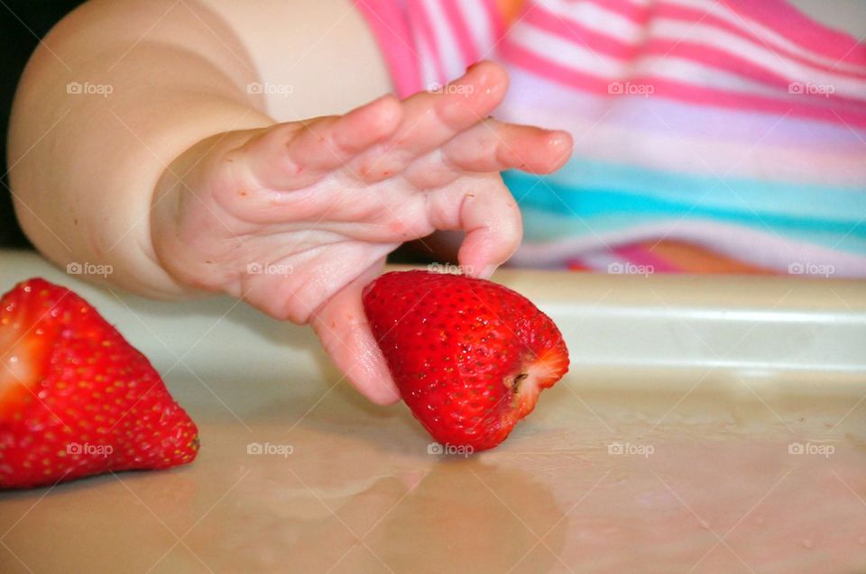 Picking up a strawberry 