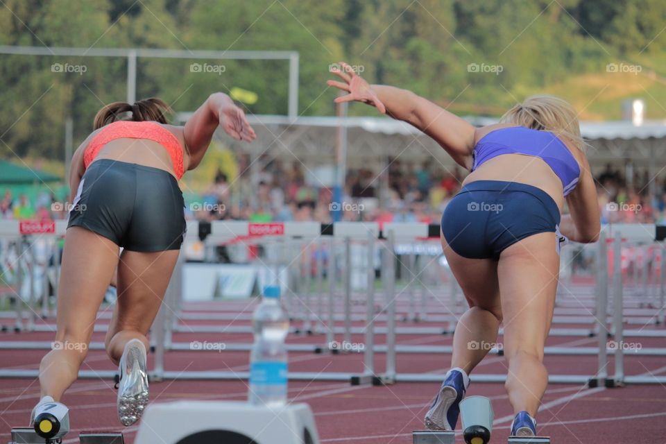 Female Sprinters Taking Off. Sprinters Clelia Reuse and Sarah Laving taking off in Luzern Meeting 2015