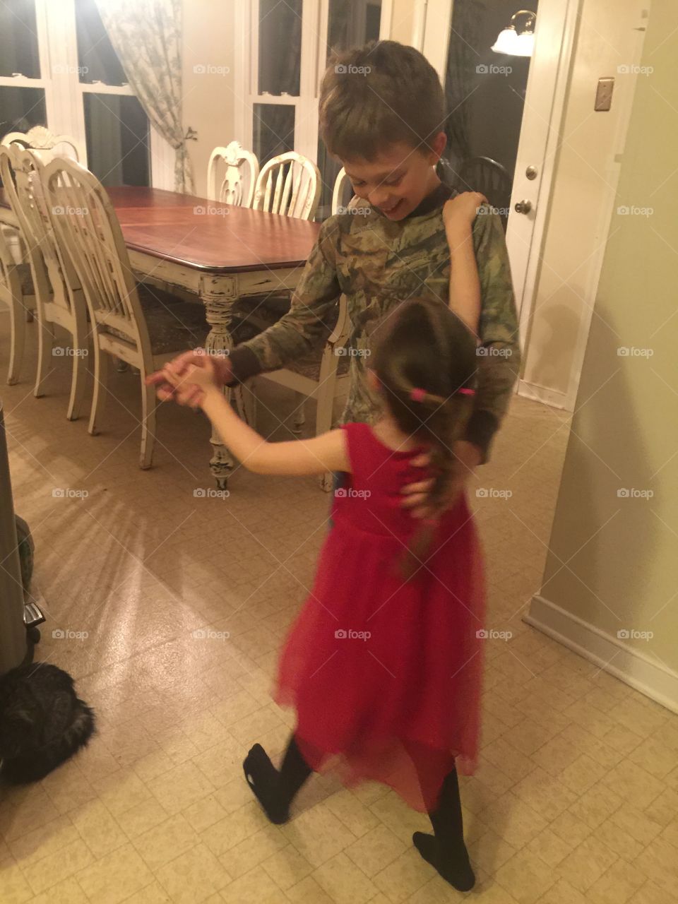 Big brother dances with little sister 