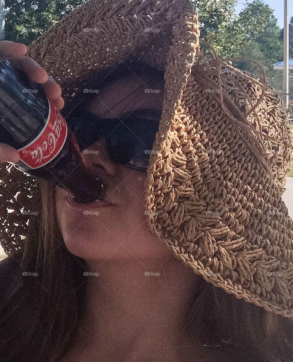 Young woman drinking cold drink