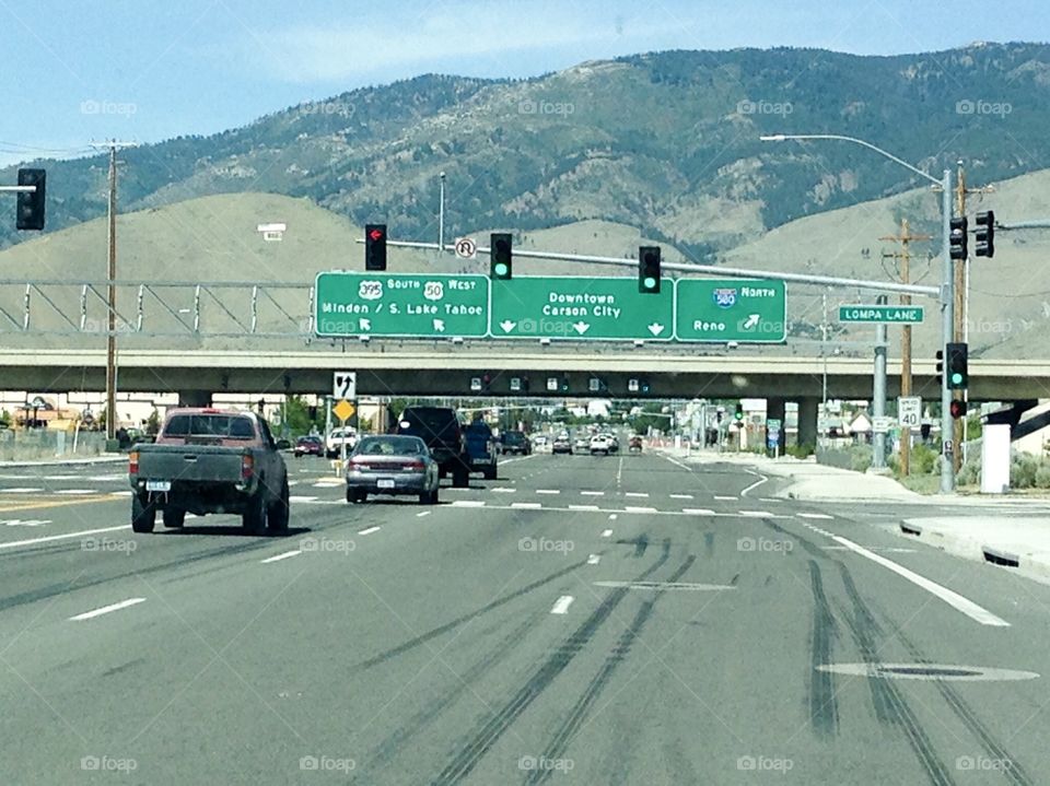 Many choices on the highway of life. Which exit? Route? Signs can confuse or lead. Here, a bush California highway freeway
