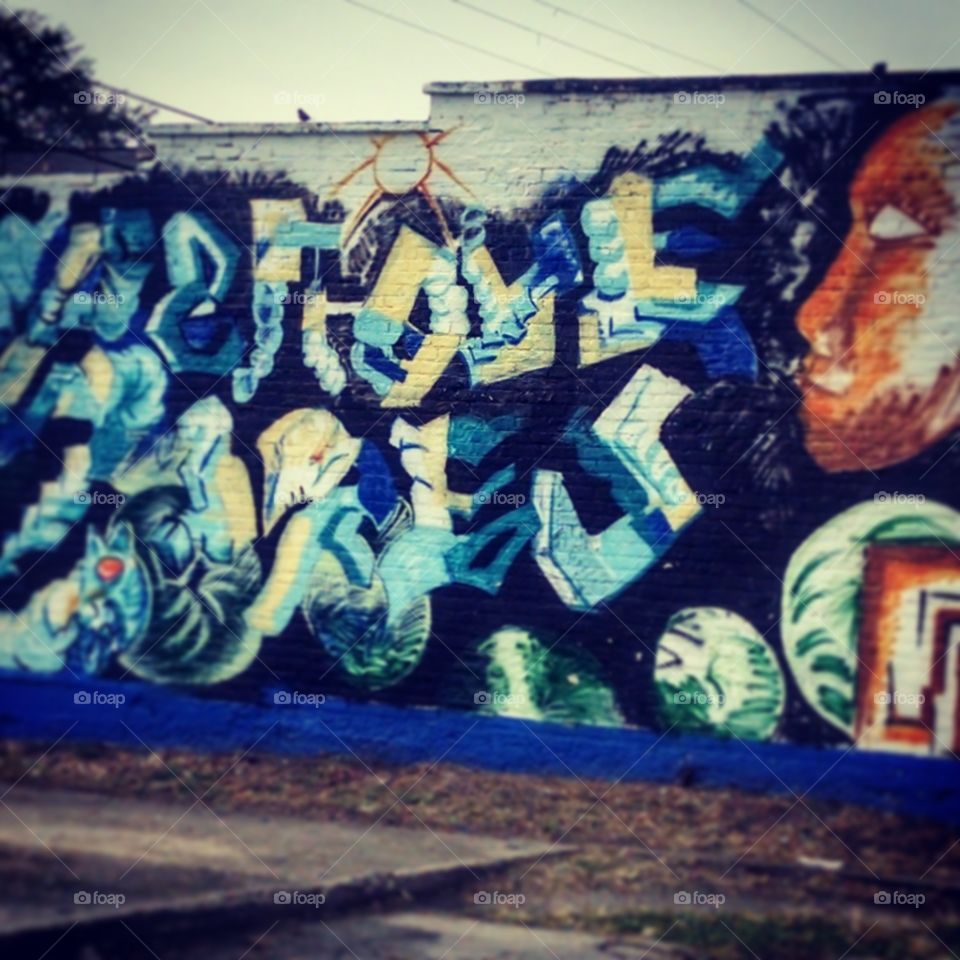 Colored Graffiti Behind Store