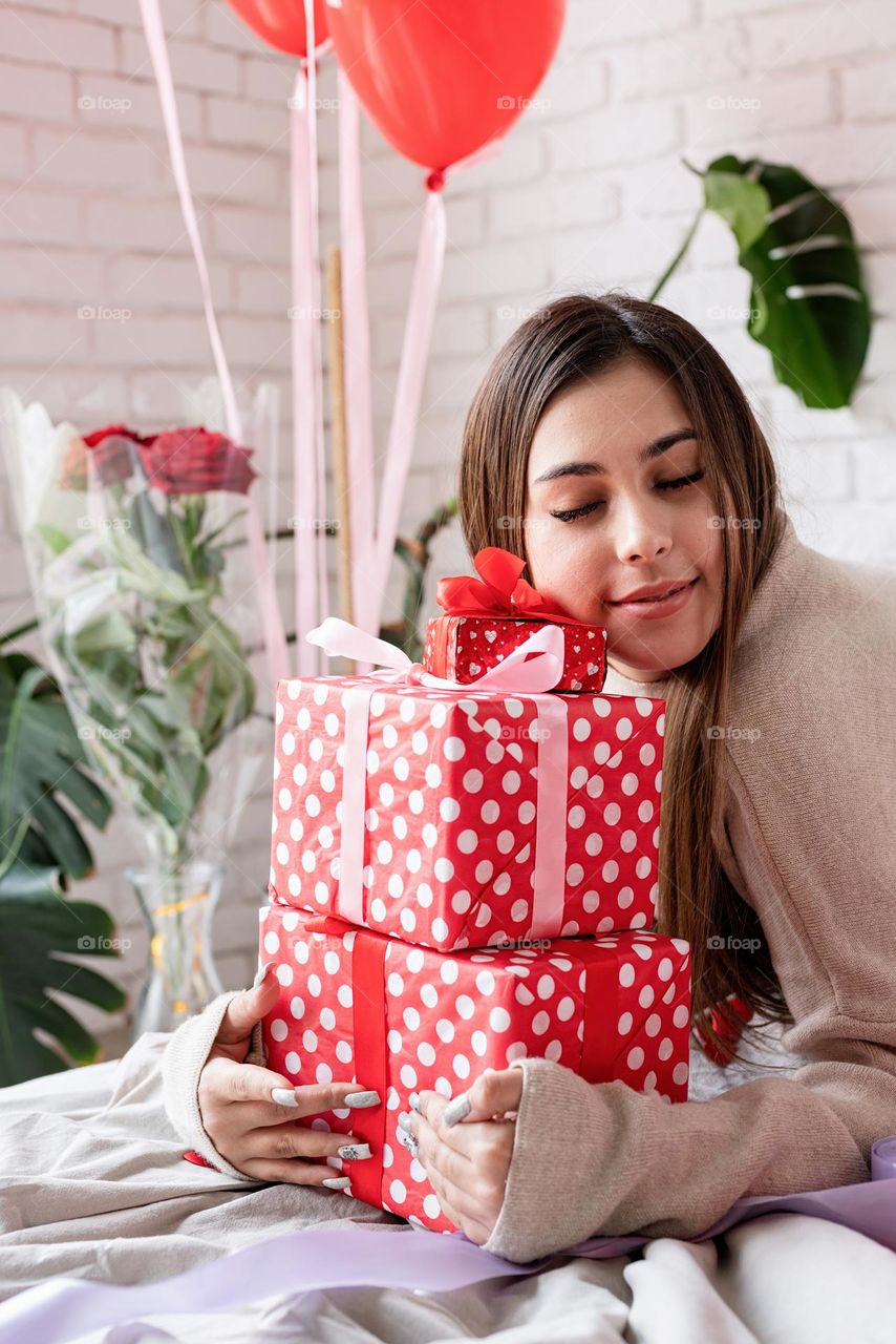 woman holding christmas gifts