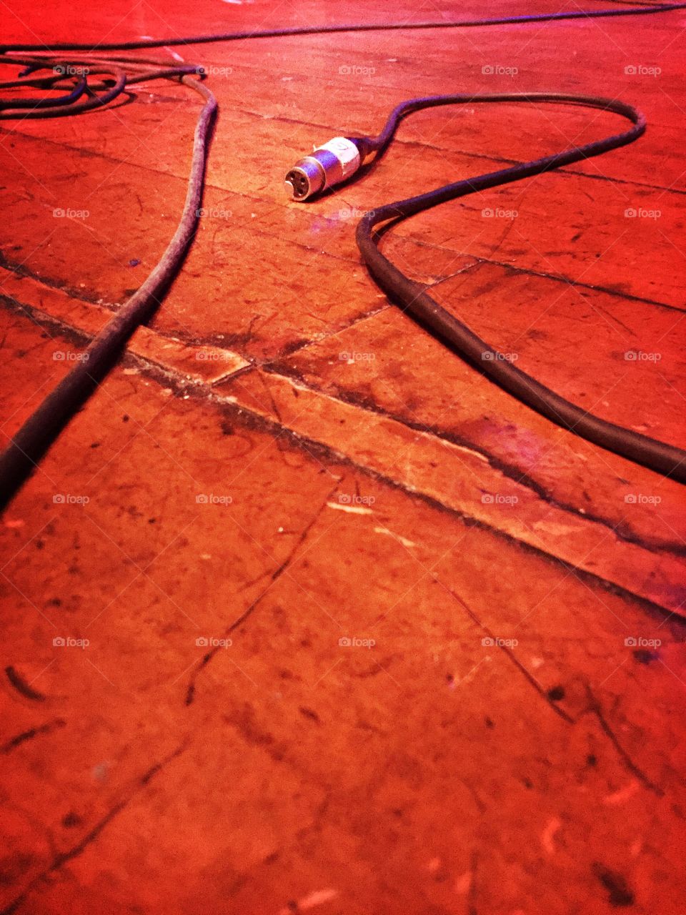 Musical instrument cables on the stage floor 