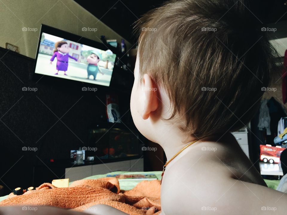 Boy watching a tv