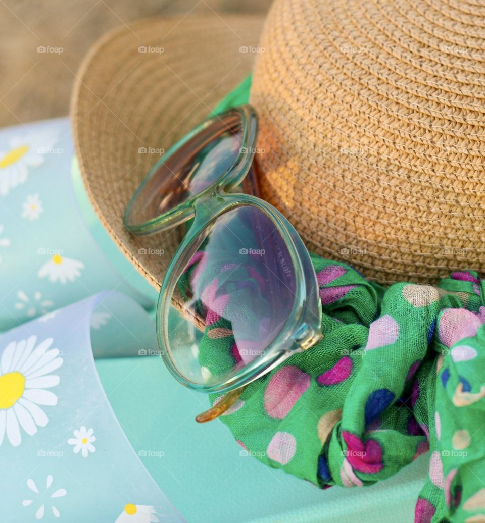 Sunglasses, hat and flip flops 