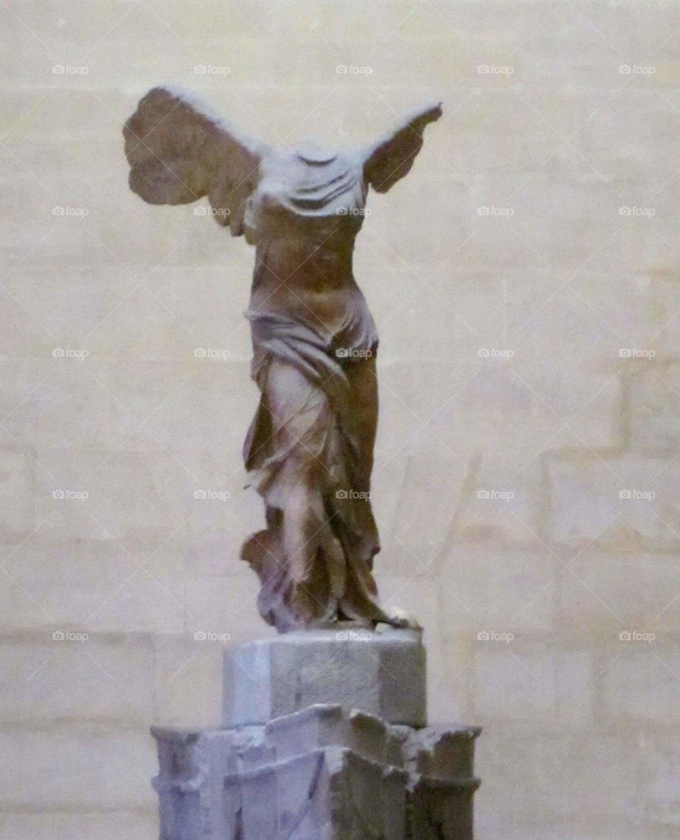 Winged Victory of Samothrace. Inside the Louvre in Paris.