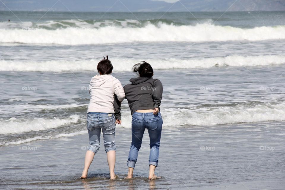 Playing girls at the beach 