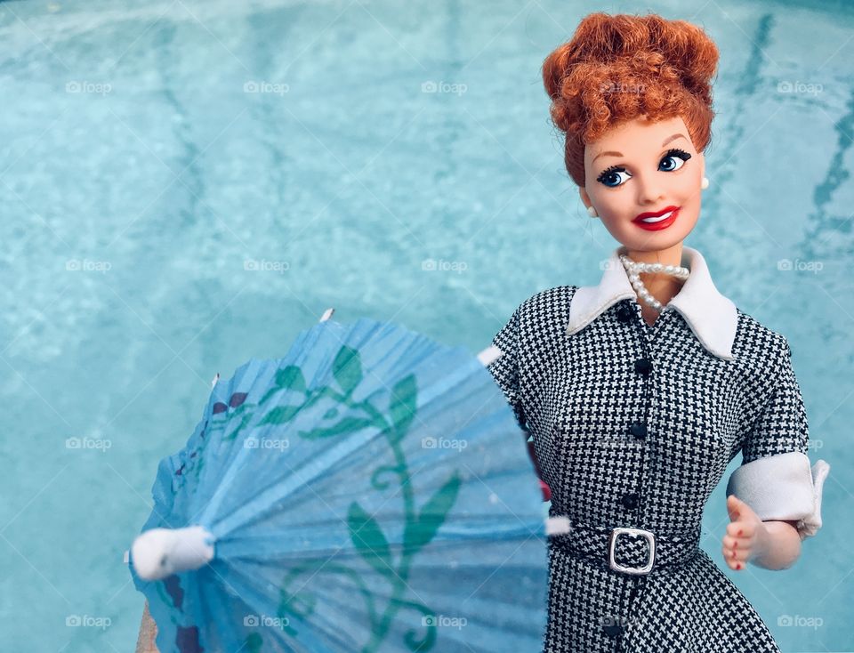 Staying dry with an umbrella and an I Love Lucy Barbie 