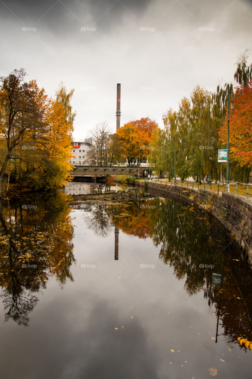 reflections in the river flowing through downtown Borås Sweden