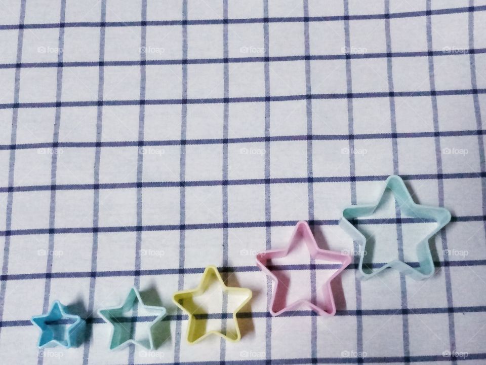 colorful stars with bluey white background